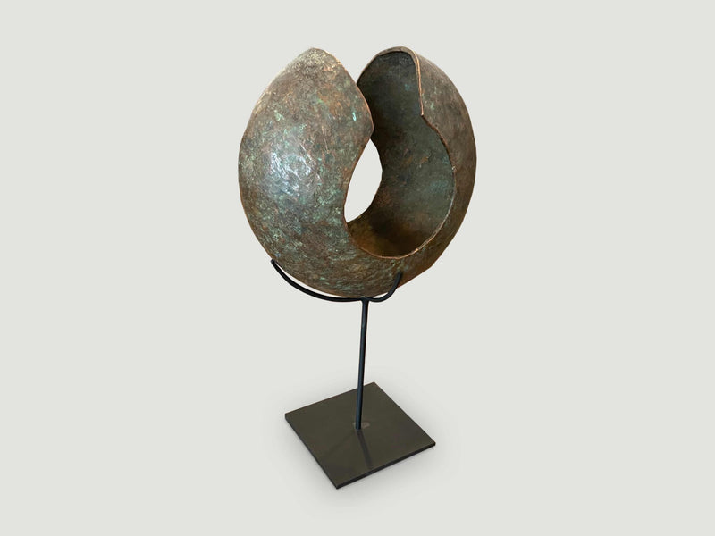 Copper African Currency on Modern Stand