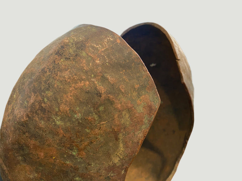 Copper African Currency on Modern Stand