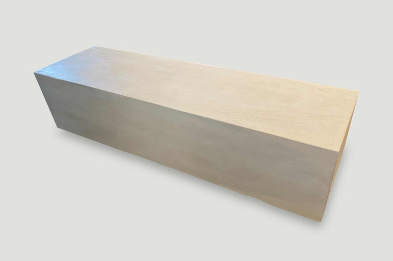 Minimalist Bleached Log Floating on Stainless Steel Cylinders