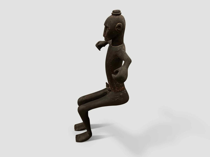 Antique Sitting Man