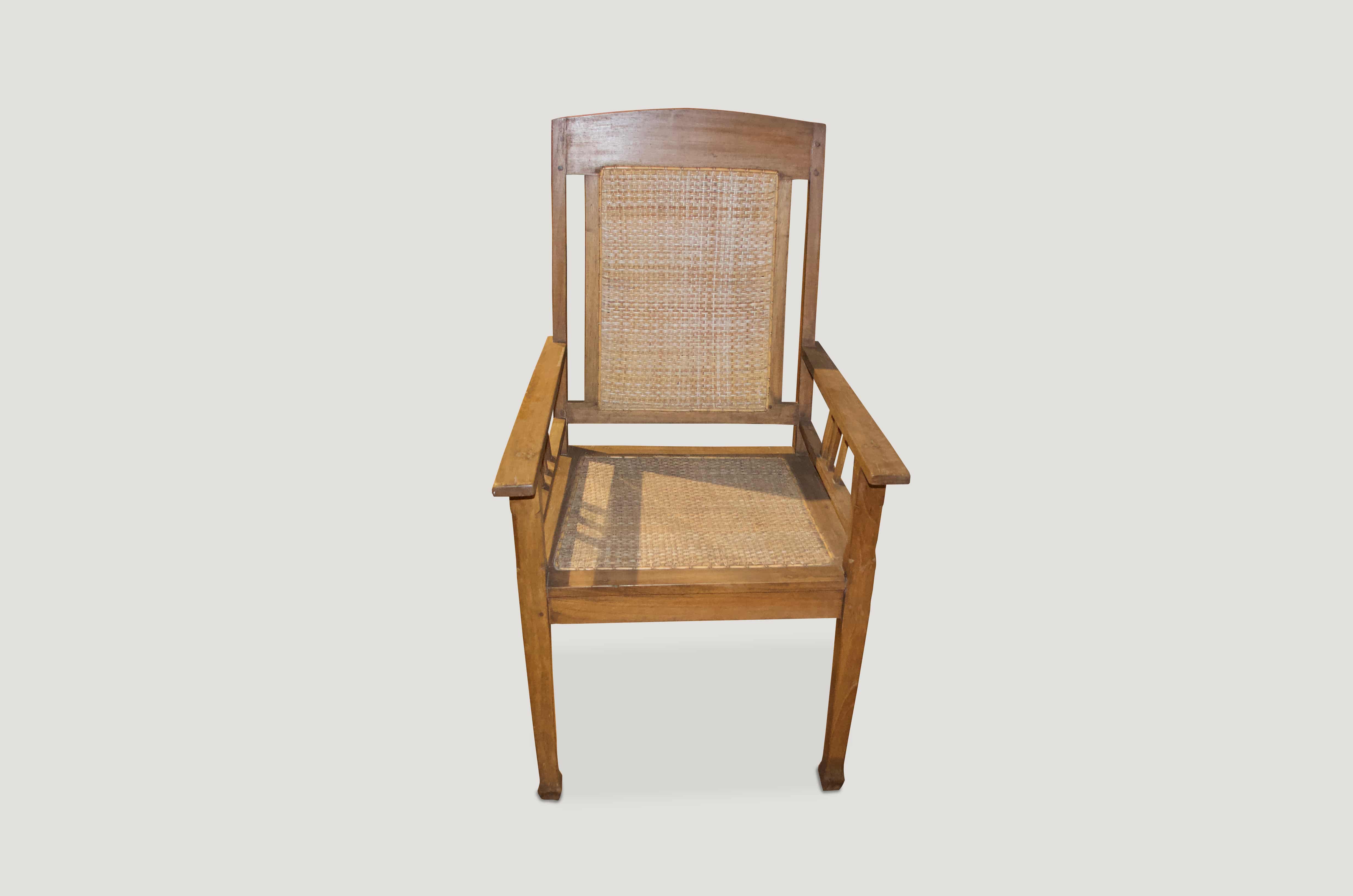 Antique Colonial teak chair with hand-woven rattan