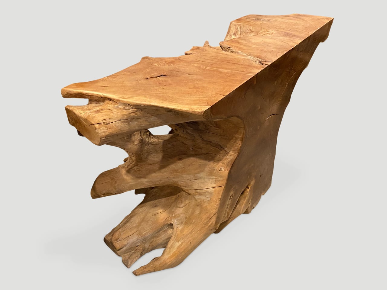 sculptural teak wood console table