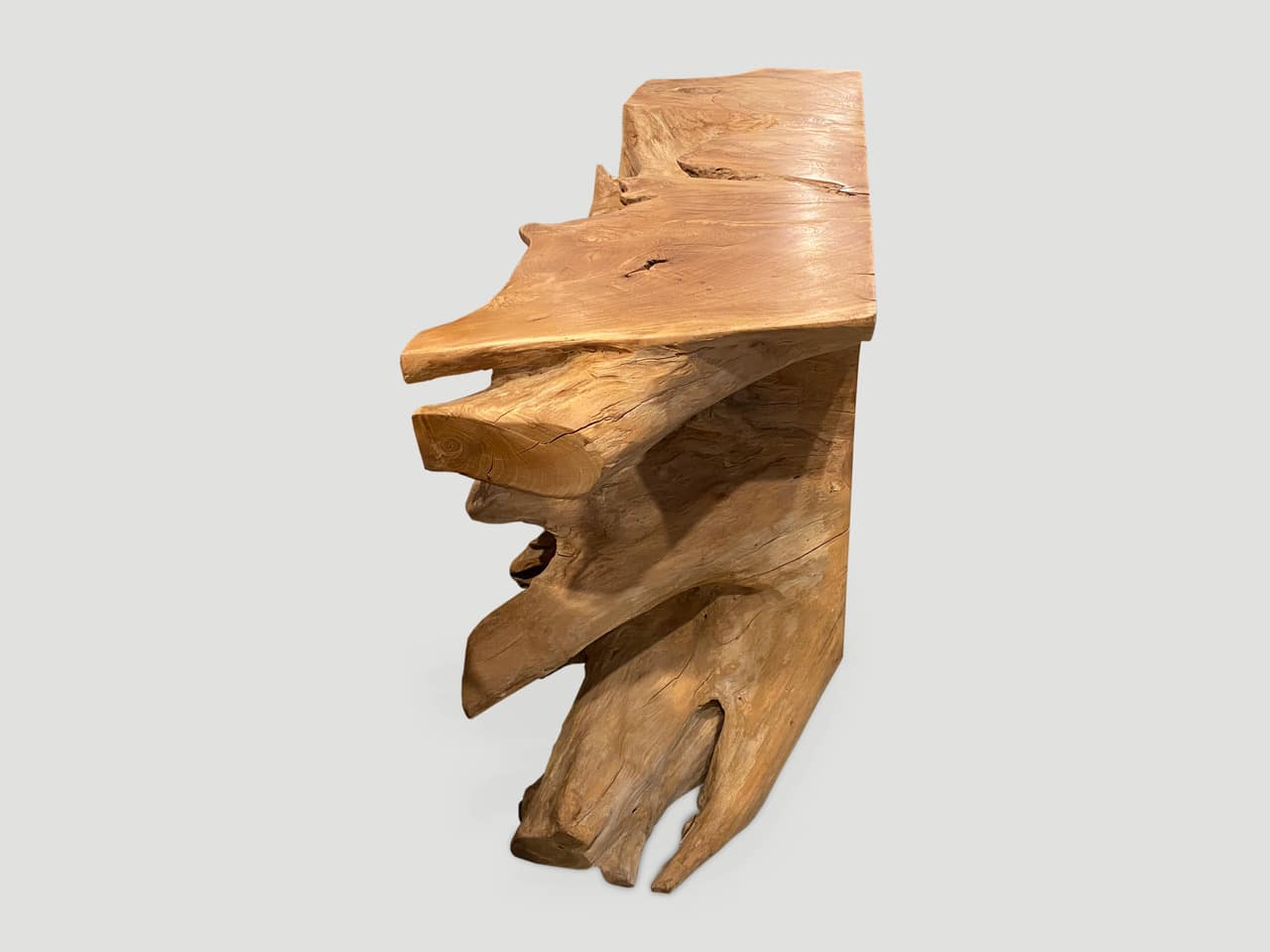 sculptural teak wood console table