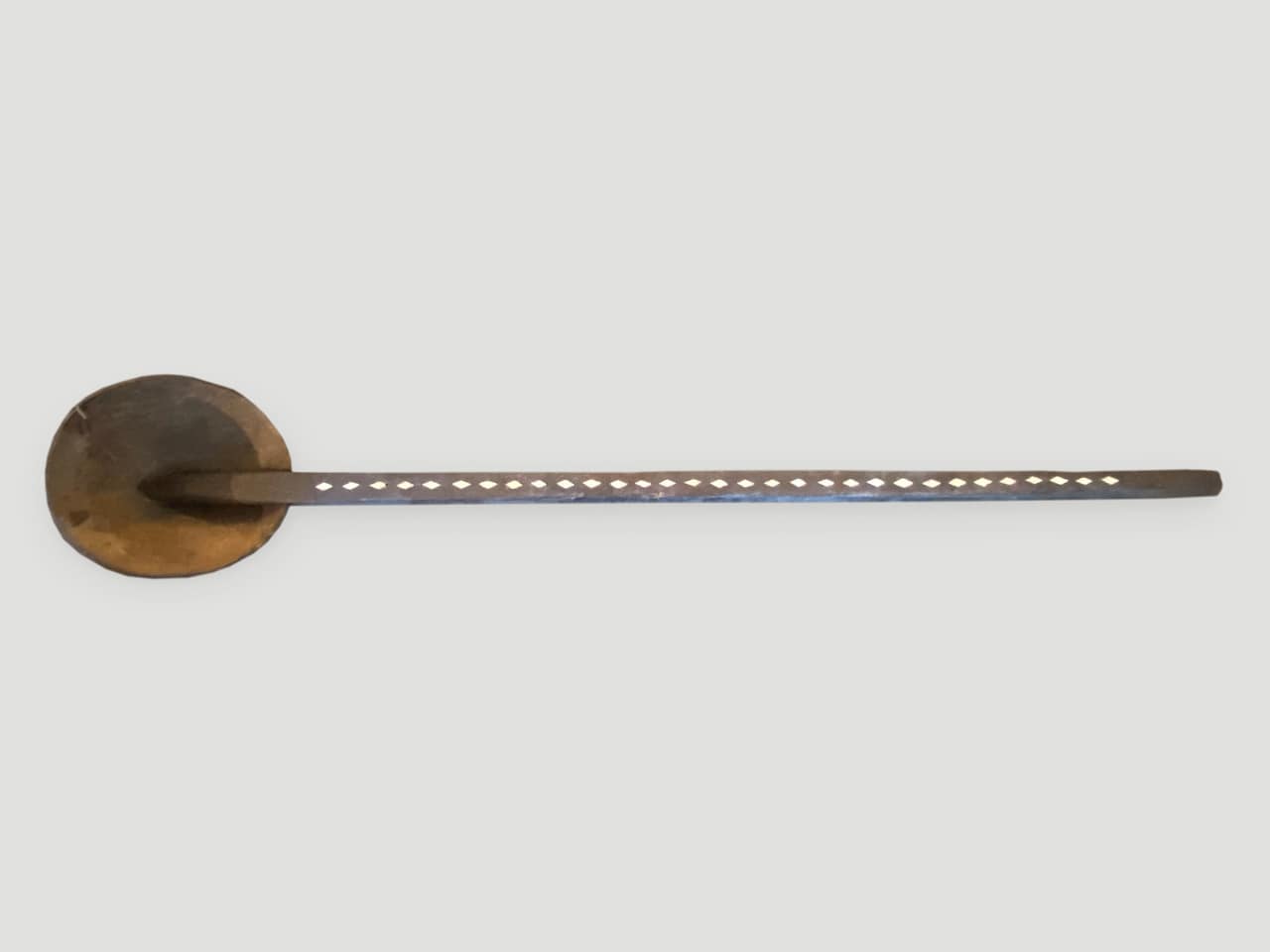 unique wooden ladle with a half coconut shell attached