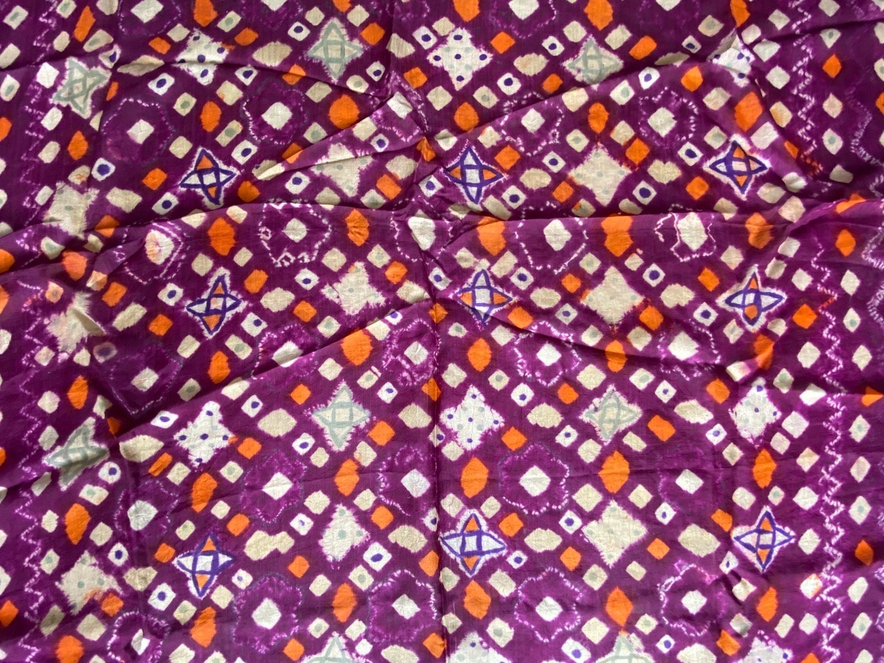 orange and purple silk textile
