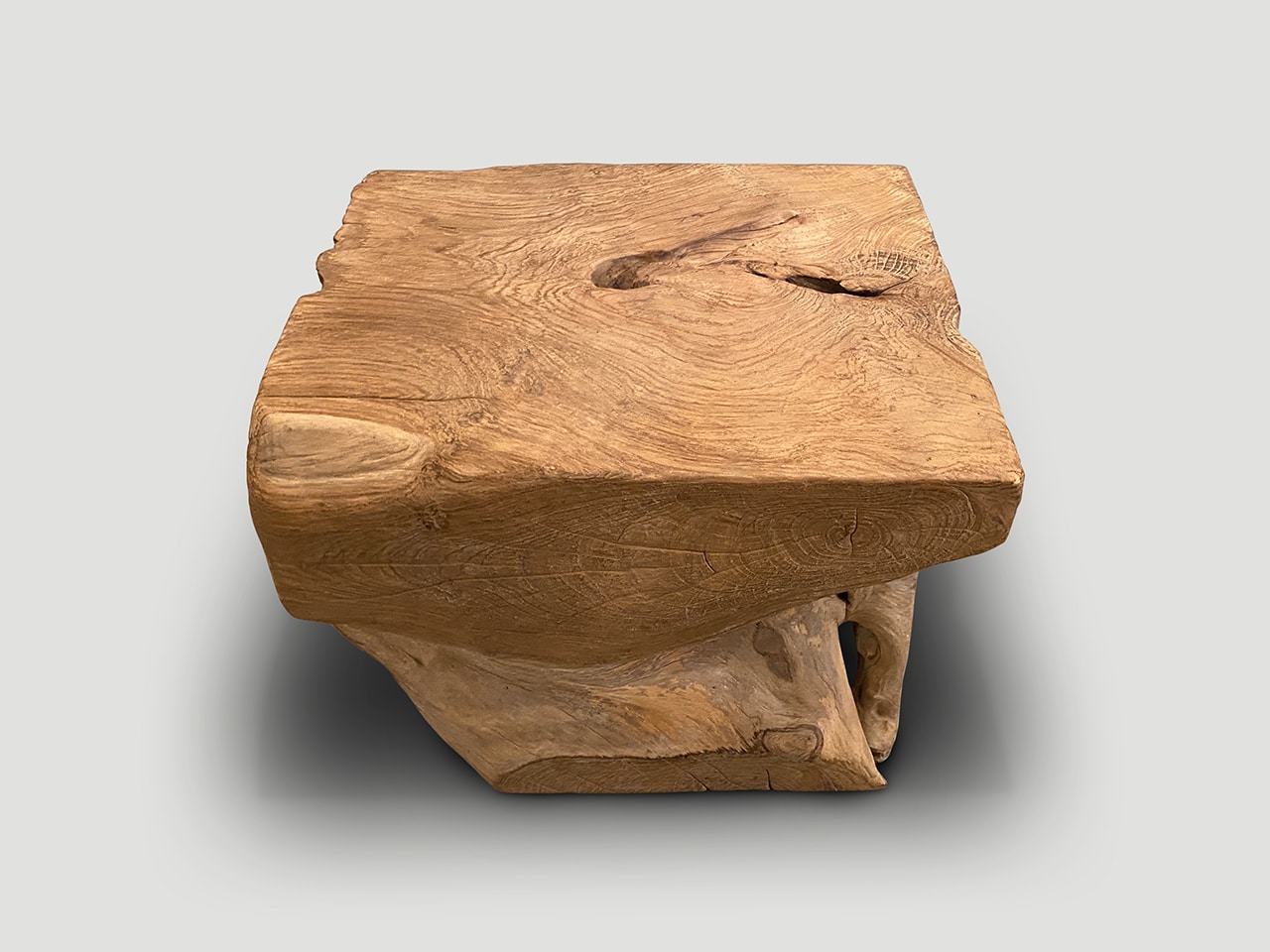 aged teak wood side table