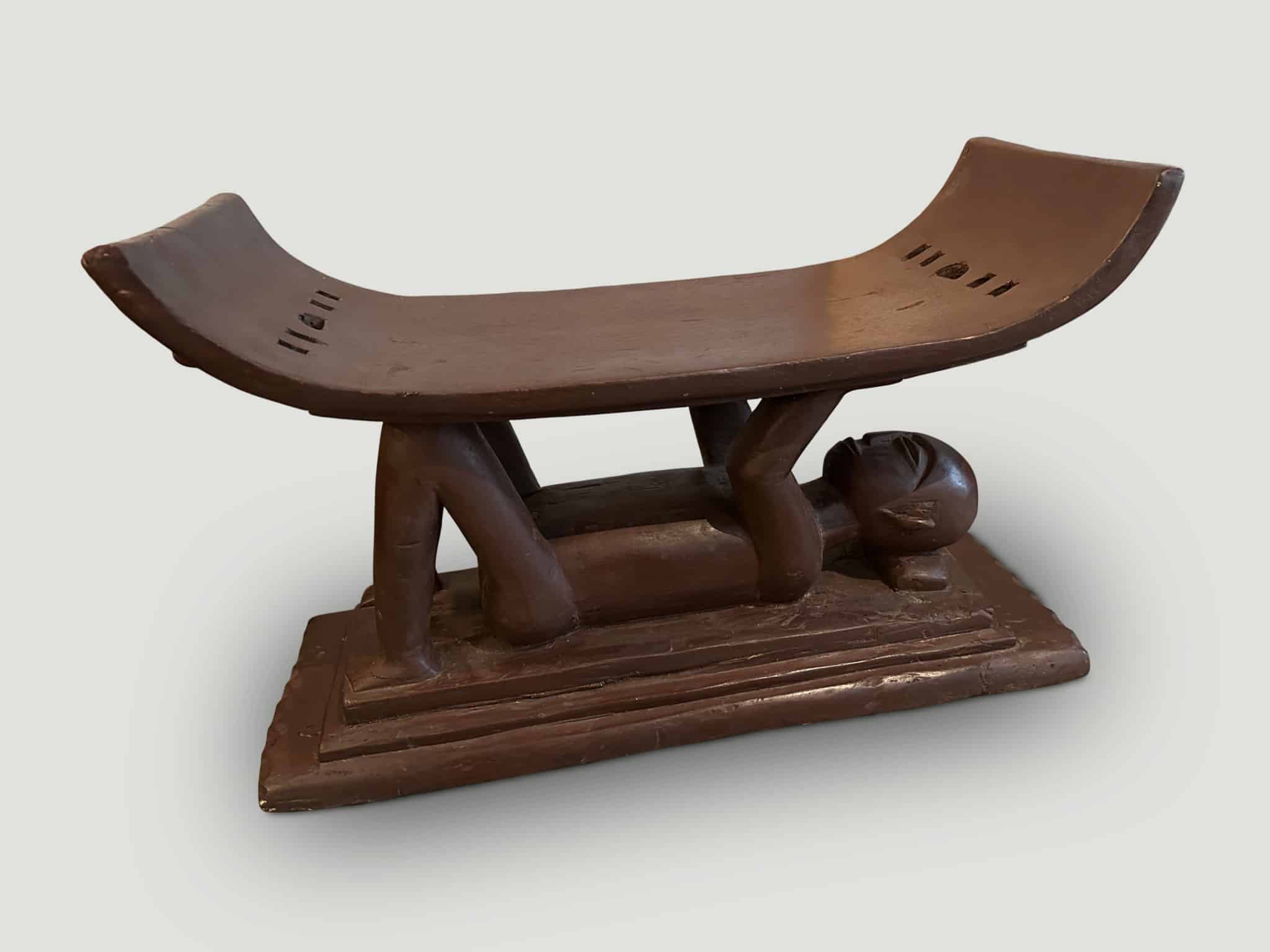 ANTIQUE ASHANTI STOOL WITH A HAND CARVED MONK