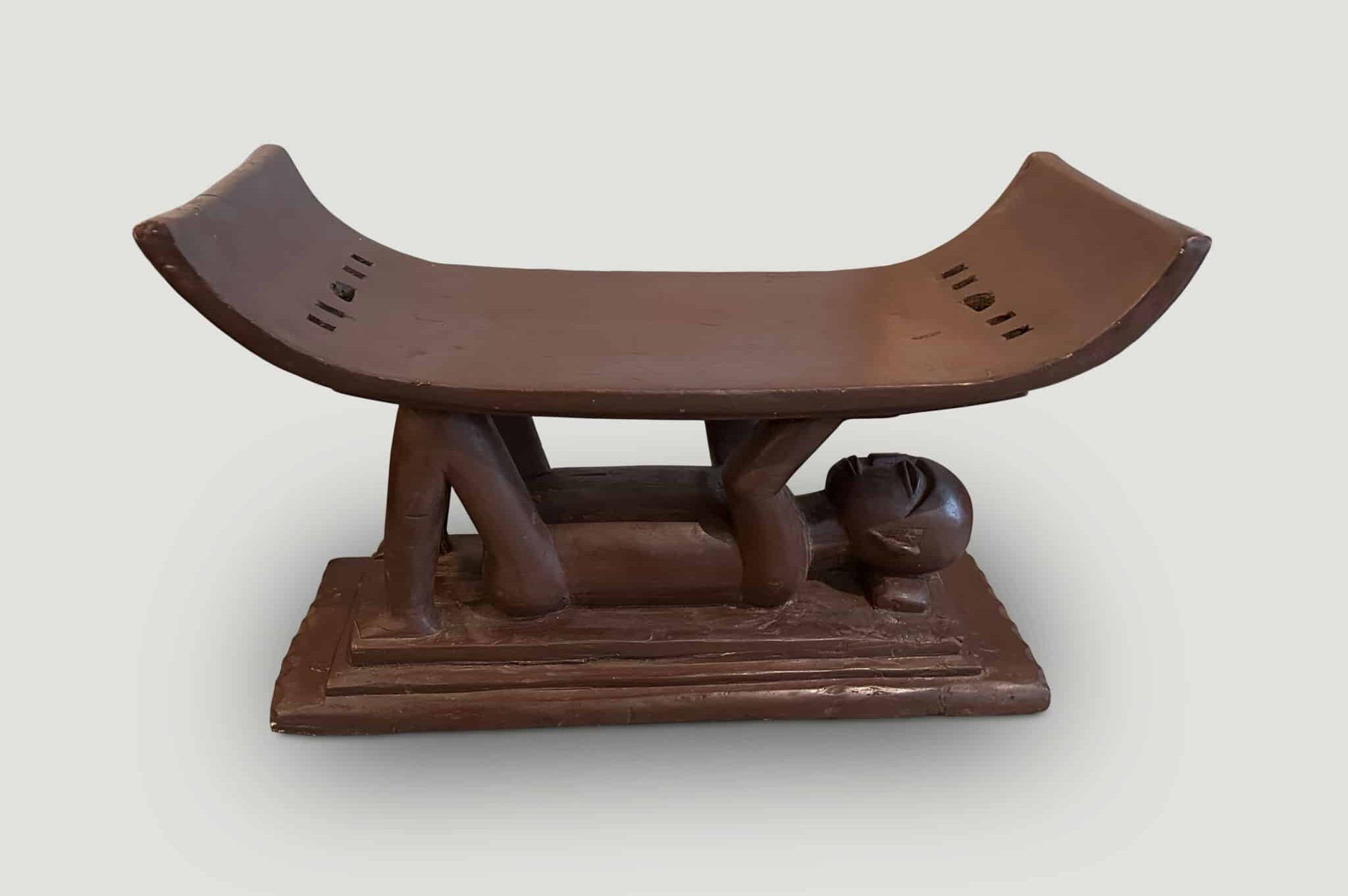 ANTIQUE ASHANTI STOOL WITH A HAND CARVED MONK