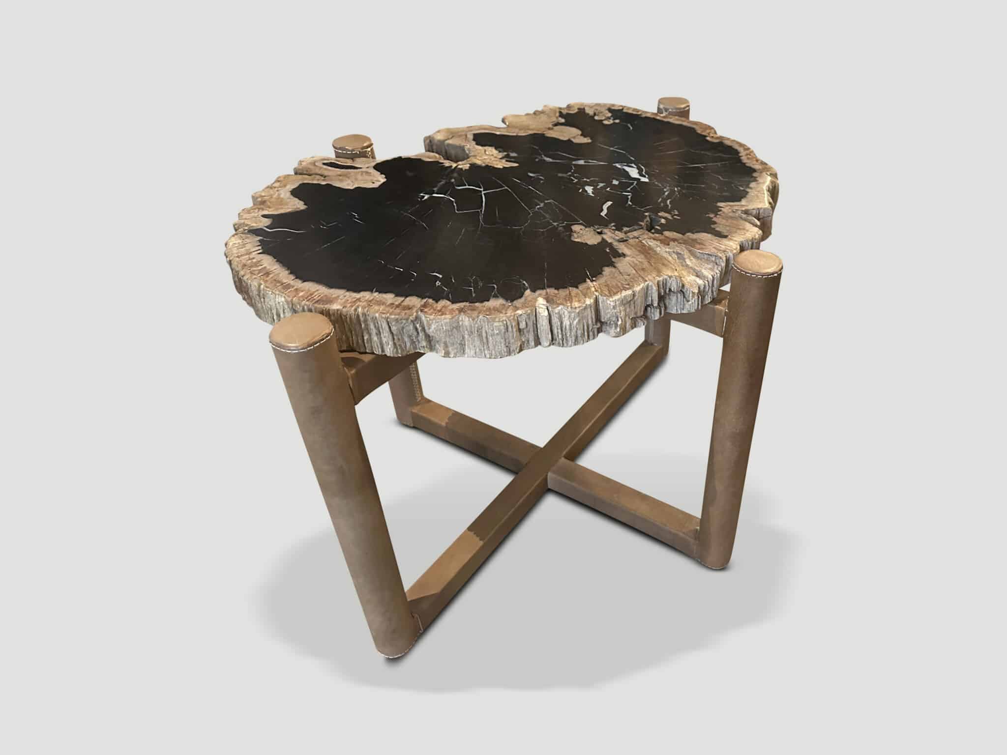 petrified wood side table on leather base