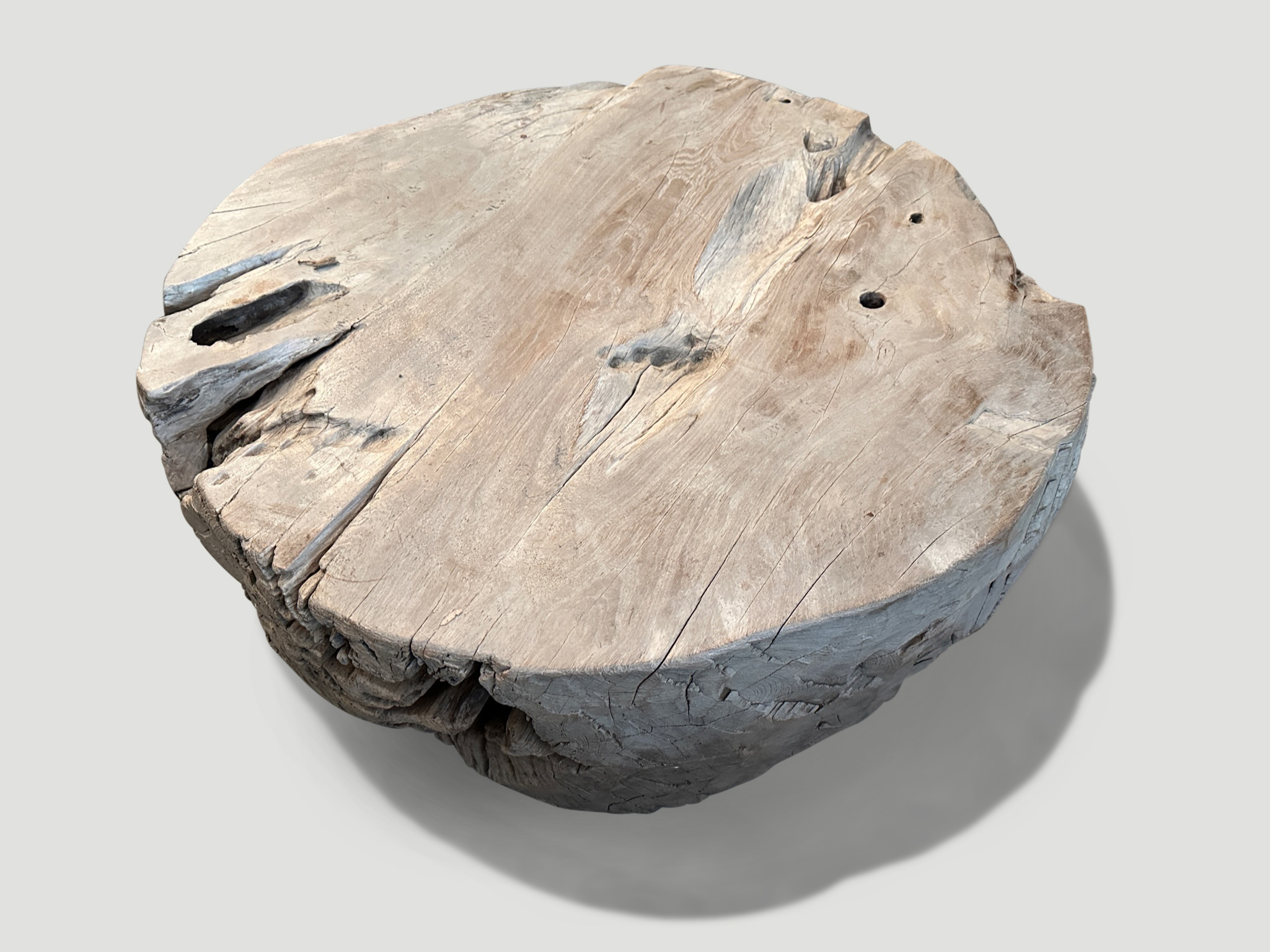 aged teak wood round coffee table