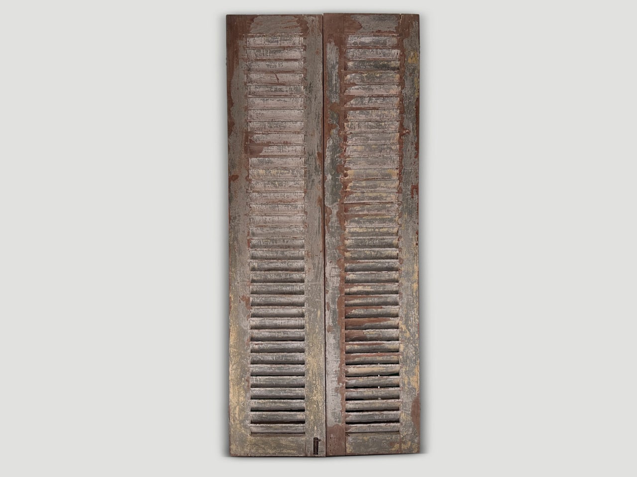 antique shutters with the remnants of the original color