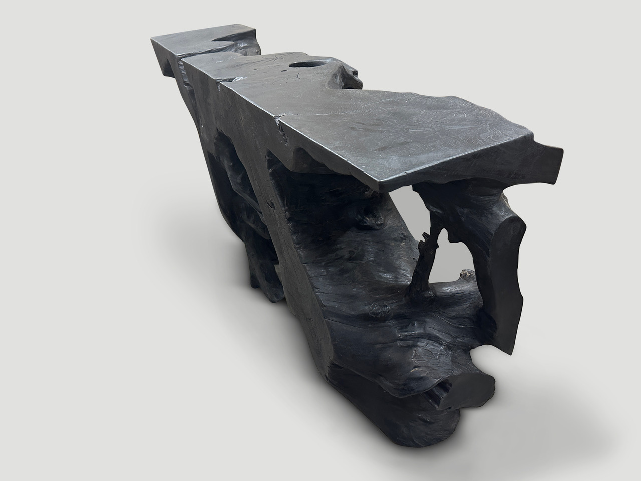 sculptural teak wood charred console table