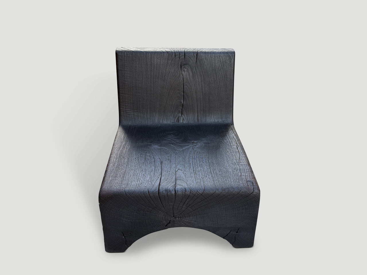 minimalist charred teak low chair