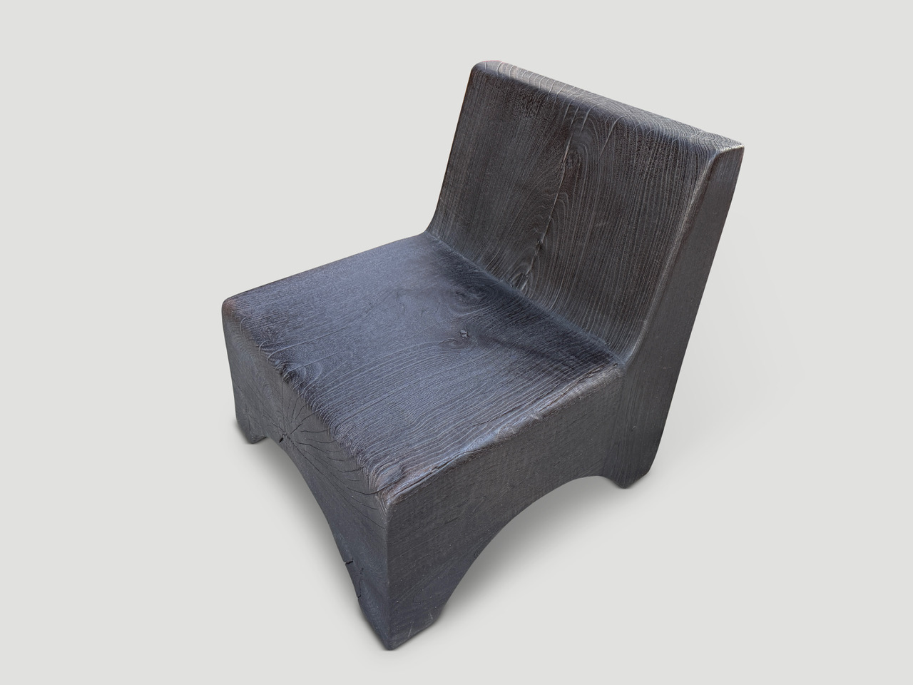 minimalist charred teak low chair