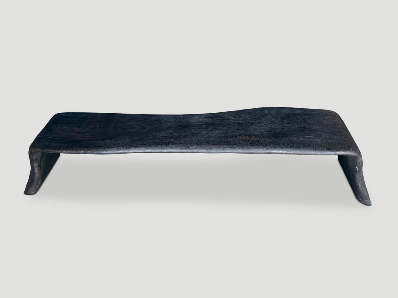 charred coffee table or bench