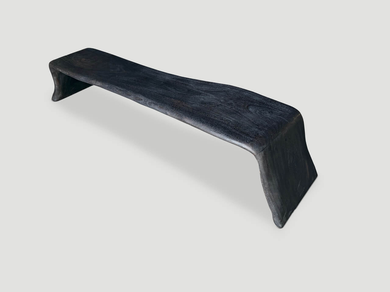 charred coffee table or bench