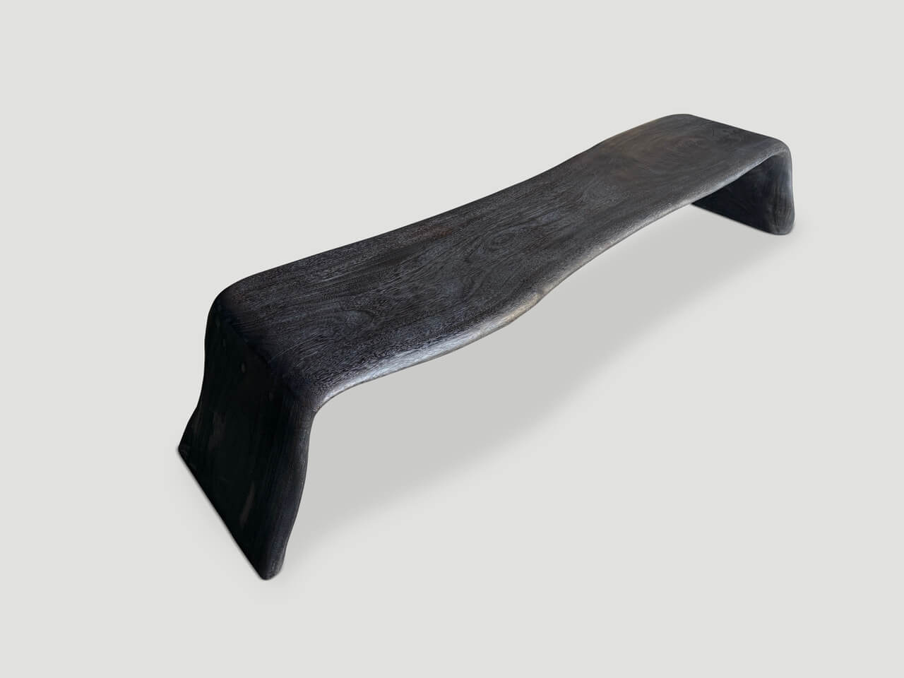 charred coffee table or bench