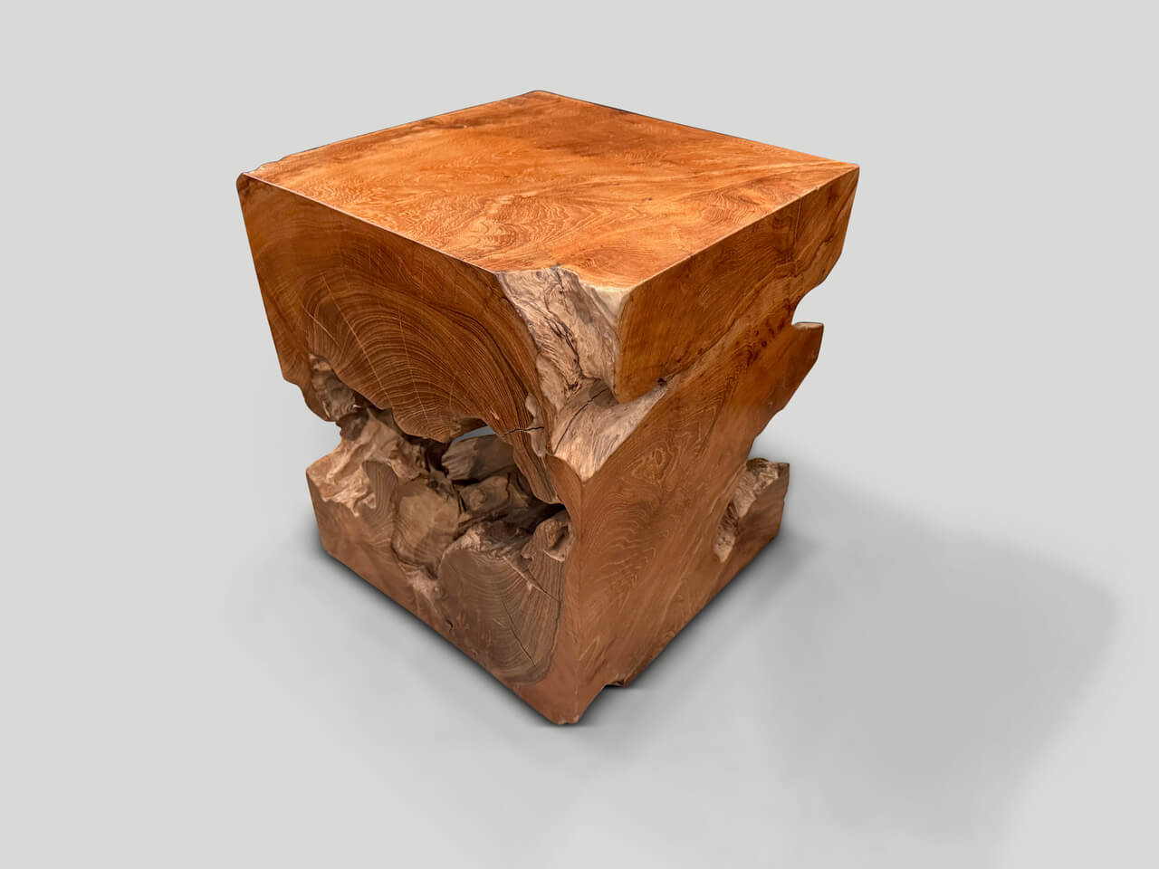 sculptural teak wood side table