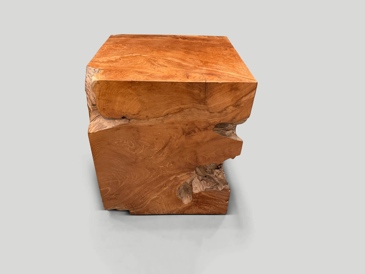 sculptural teak wood side table