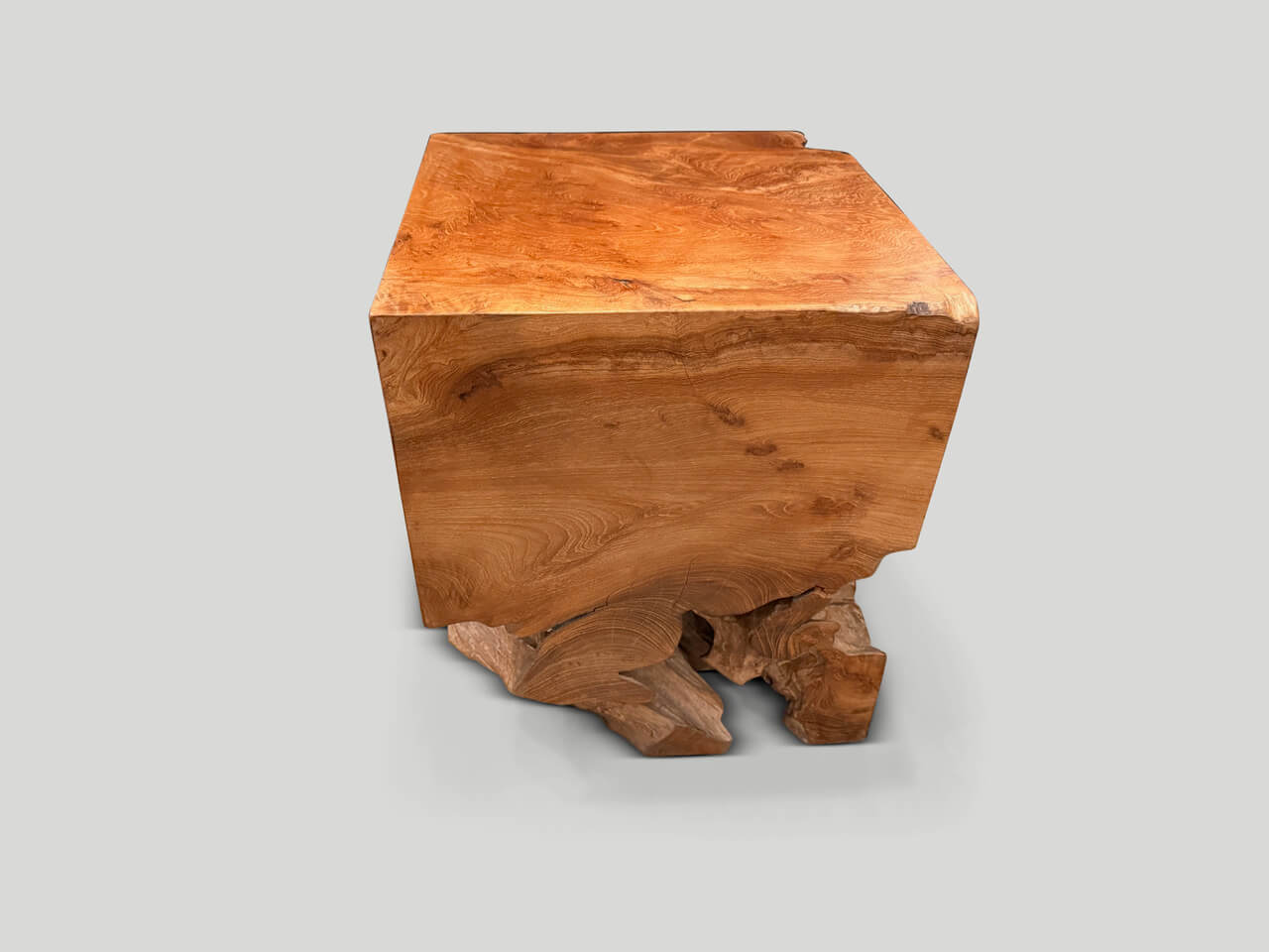sculptural teak wood side table