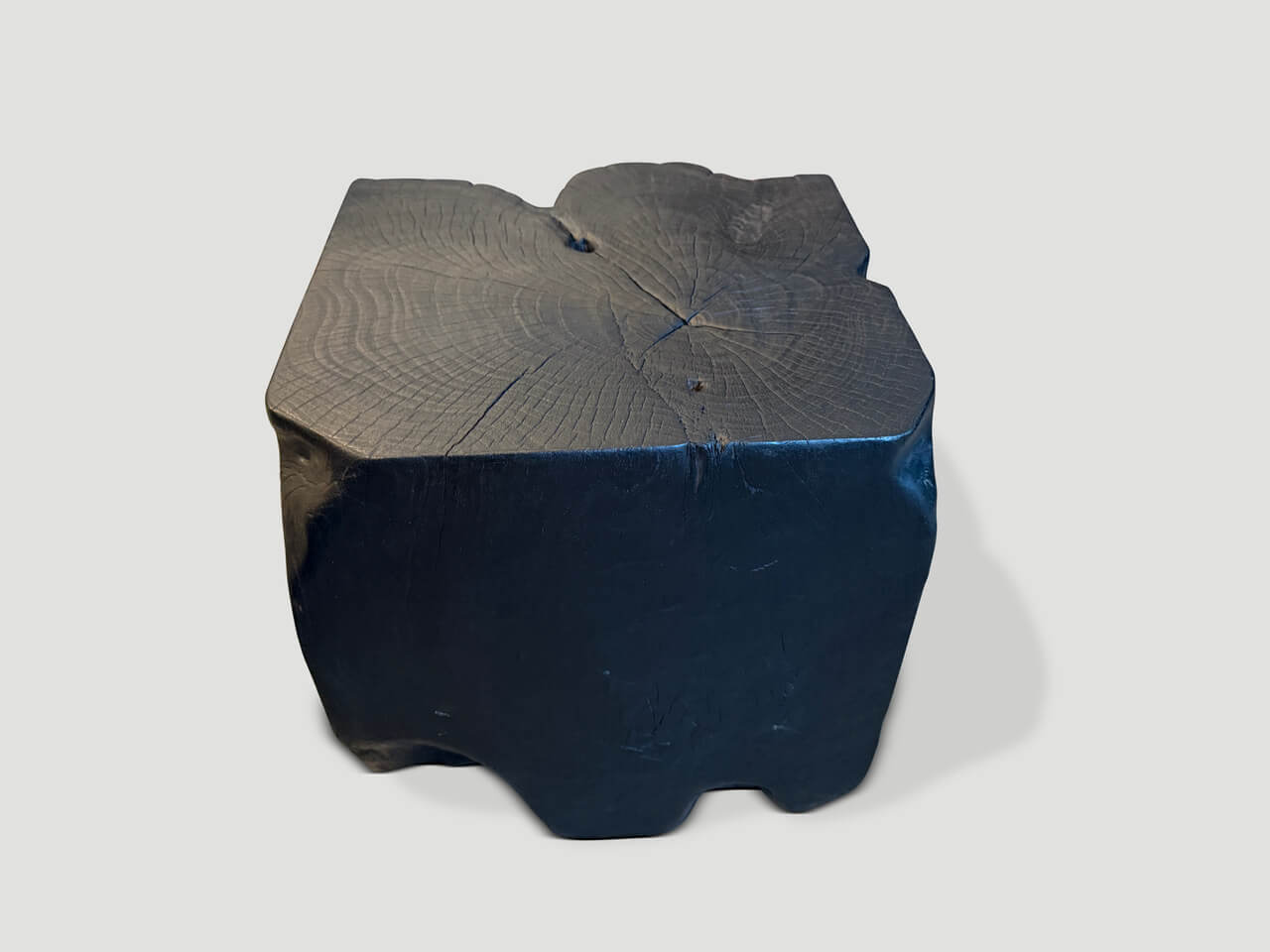 sculptural charred teak wood side table