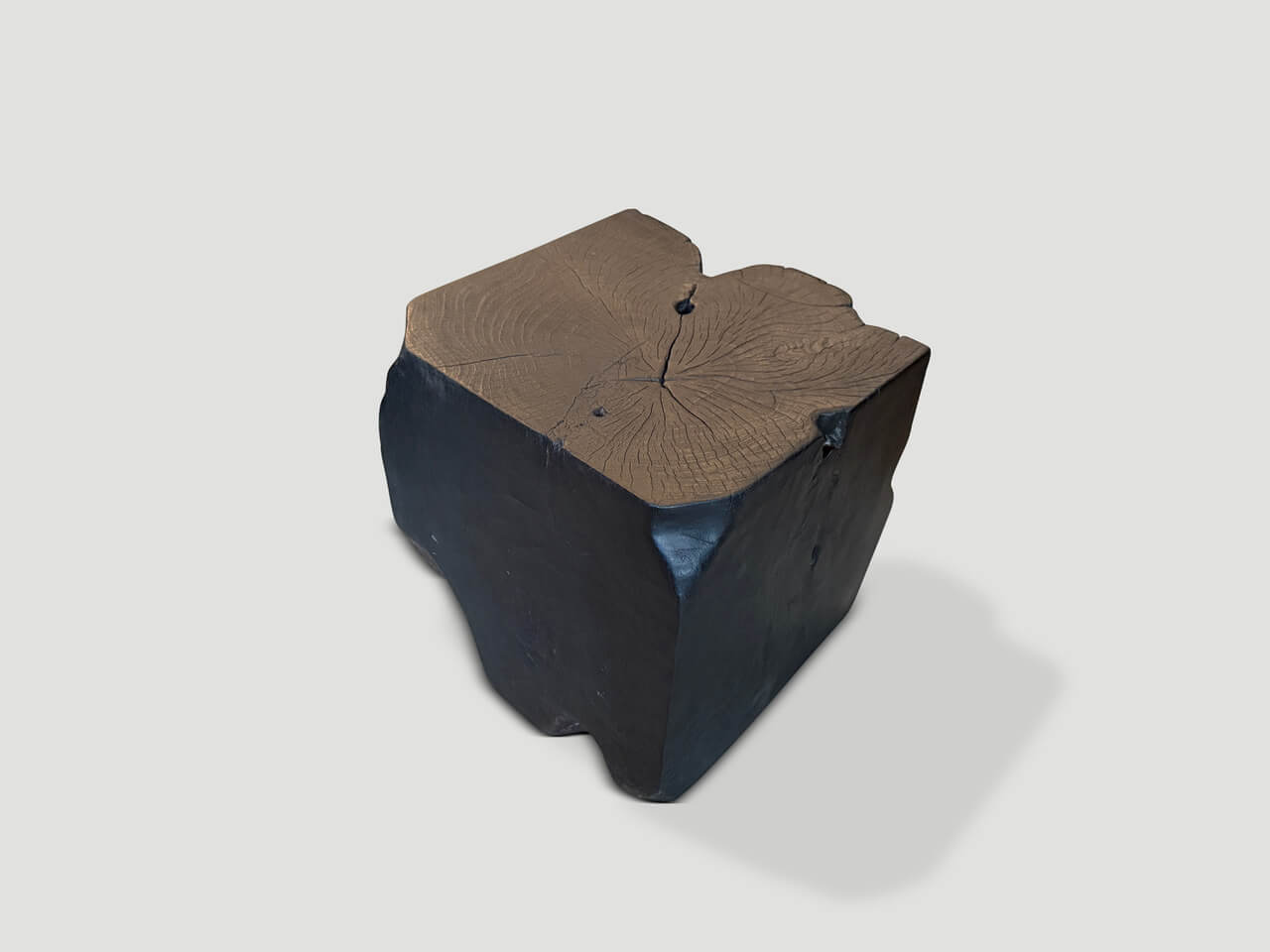sculptural charred teak wood side table