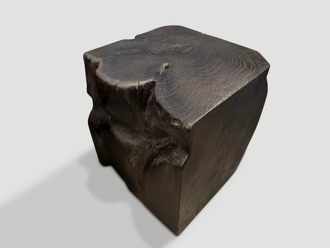 sculptural charred teak wood side table