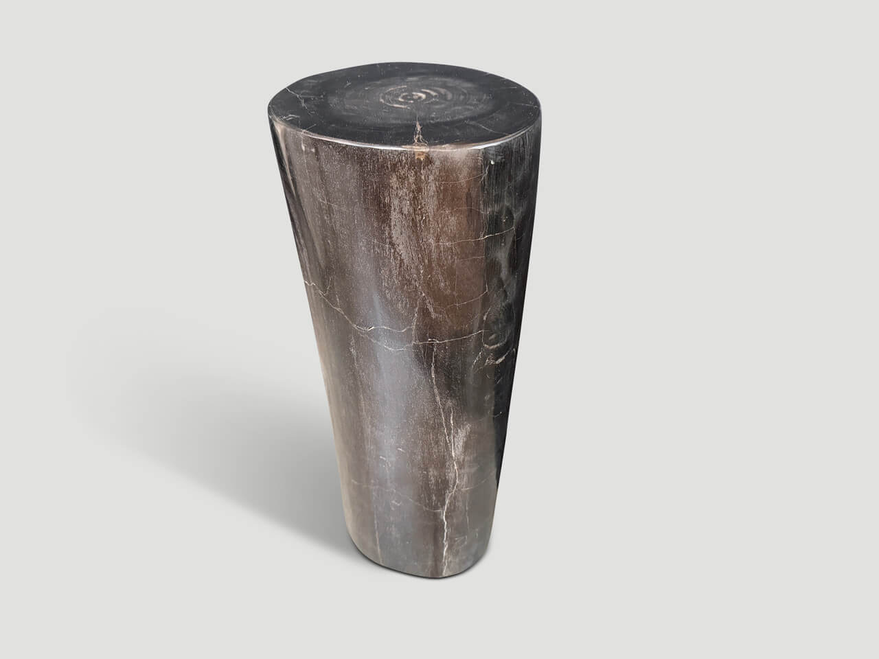 MINIMALIST COLUMN PETRIFIED WOOD SIDE TABLE.